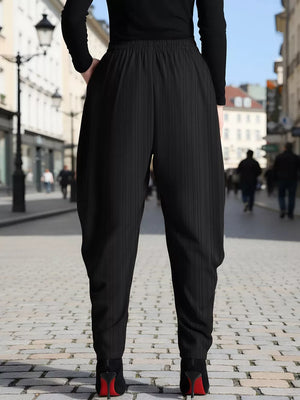 Black plus size ribbed casual pants with pinstripe detail and elastic waistband.