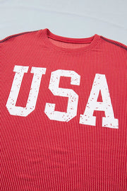 Red twisted rib t-shirt with distressed white USA graphic and crew neck.