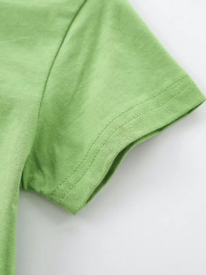 Green 100% cotton toddler t-shirt with short sleeves and double-stitched hem.
