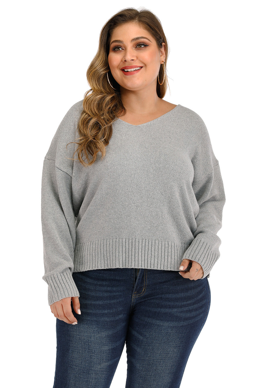 Plus size grey knit sweater with v-neck and ribbed cuffs and hem