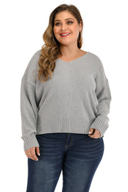 Plus size grey knit sweater with v-neck and ribbed cuffs and hem