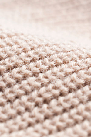 Tan ribbed knit beanie with a fuzzy acrylic texture