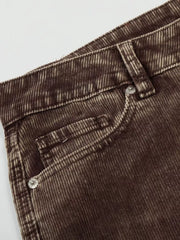 Brown corduroy joggers for men with wide-leg cut and button details.