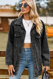 Black oversized denim trucker jacket with classic buttoned front and chest pockets.