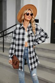 Oversized black and white plaid shacket with button front and chest pockets.