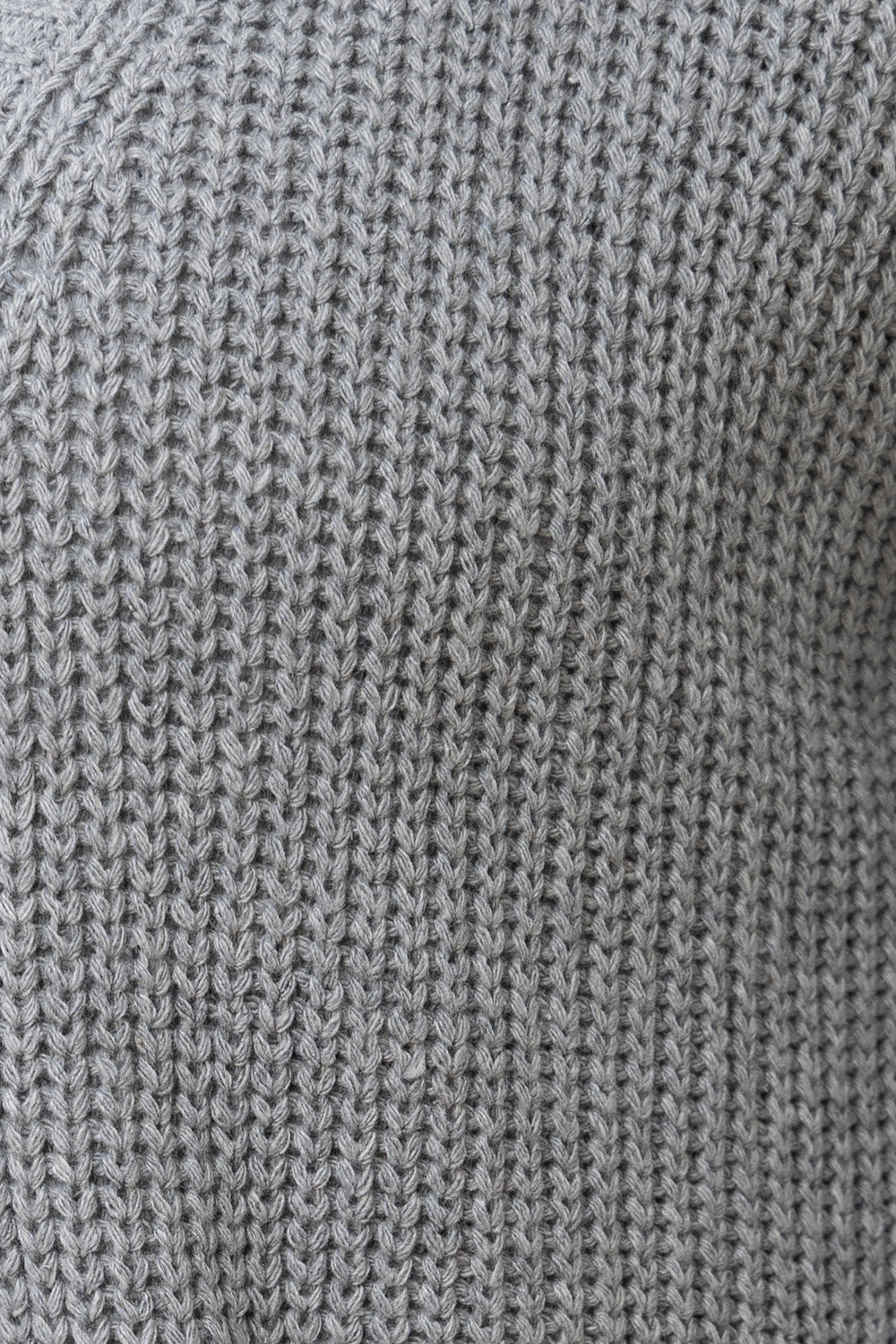 Dark gray ribbed knit oversized cardigan with pockets.