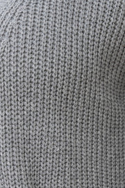 Dark gray ribbed knit oversized cardigan with pockets.