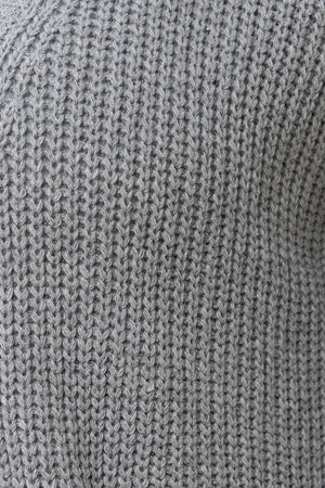 Dark gray ribbed knit oversized cardigan with pockets.