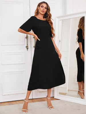 Black midi dress with short sleeves, A-line cut, and keyhole back detail.