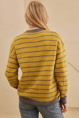 Yellow intarsia knit sweater with grey stripes and crew neck.