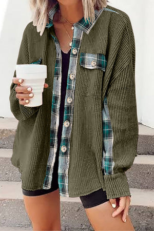 Green waffle knit overshirt with plaid trim and button front, styled open over a black tank top.