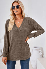 Relaxed V-neck tunic top in taupe heathered knit with long sleeves and a slouchy fit.