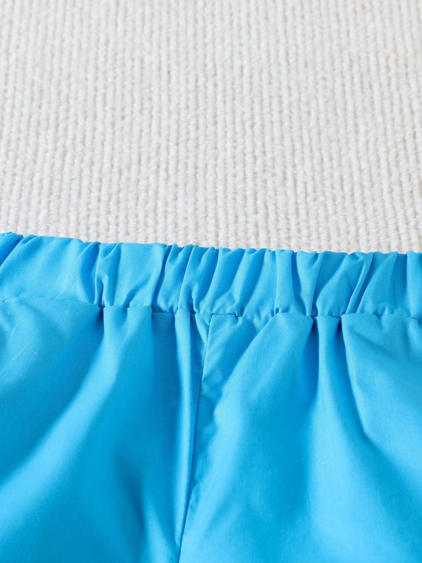 Blue cotton shorts with elastic waistband detail