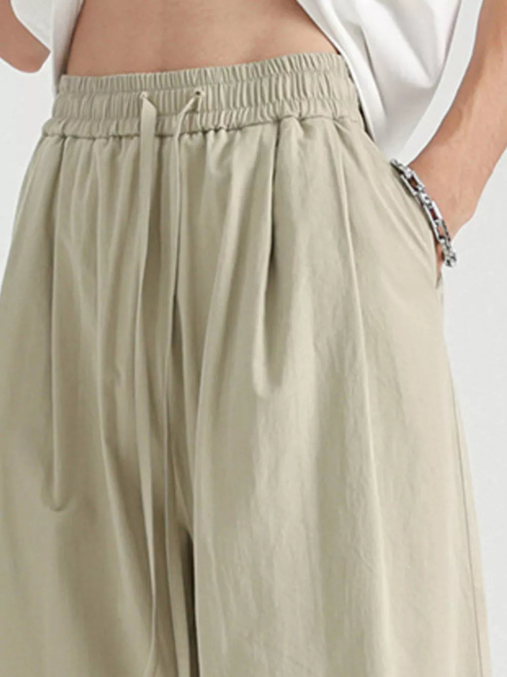 Men's khaki lightweight drawstring sweatpants with elastic waistband and adjustable tie.