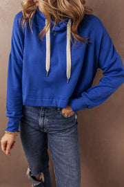 Cobalt cropped hoodie with contrast ties and a relaxed fit.