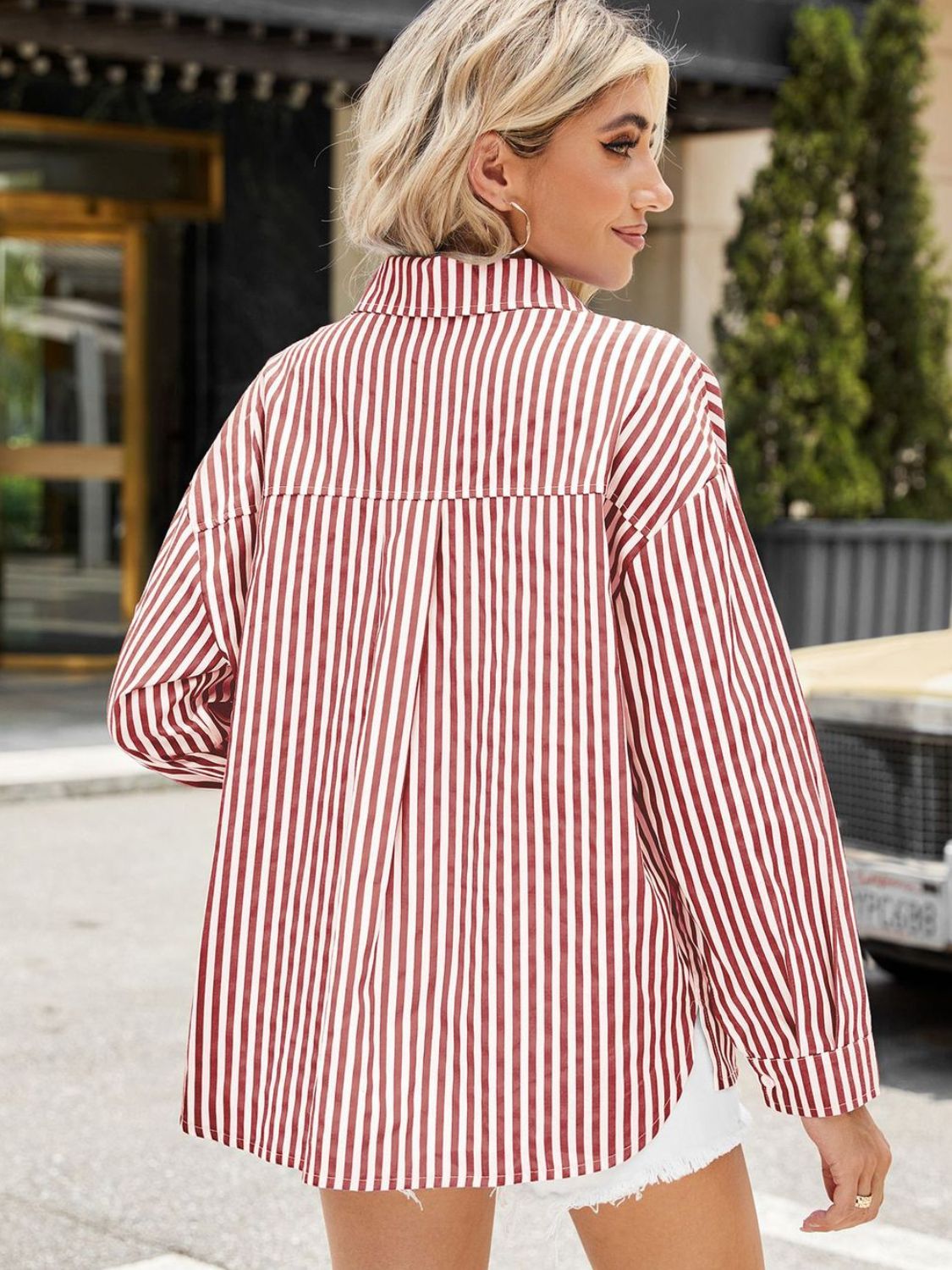 Striped oversized shirt in scarlet with button front and long sleeves.