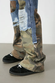Camouflage patchwork jeans with distressed denim panels and a baggy fit.