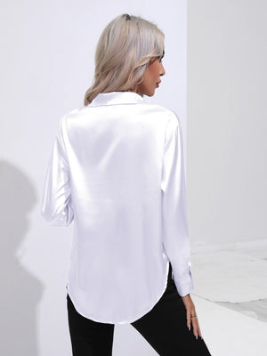 White satin tie-front blouse with a collared neckline and long sleeves.