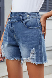 Dusty blue denim shorts with asymmetric waistline and distressed frayed hem