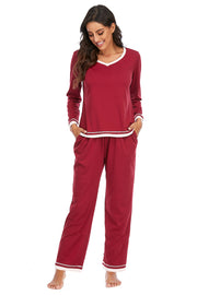Wine V-neck long sleeve pajama set with contrast trim and pockets.