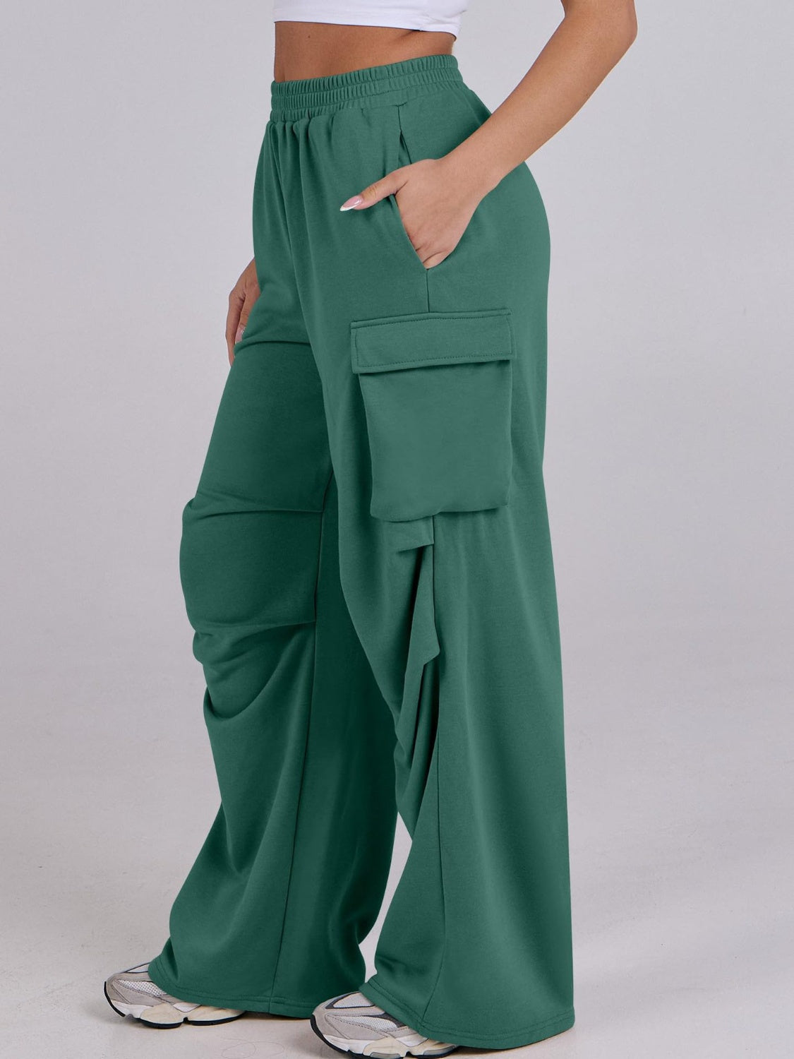 Green cargo pocket drape wide leg sweatpants with a relaxed fit.