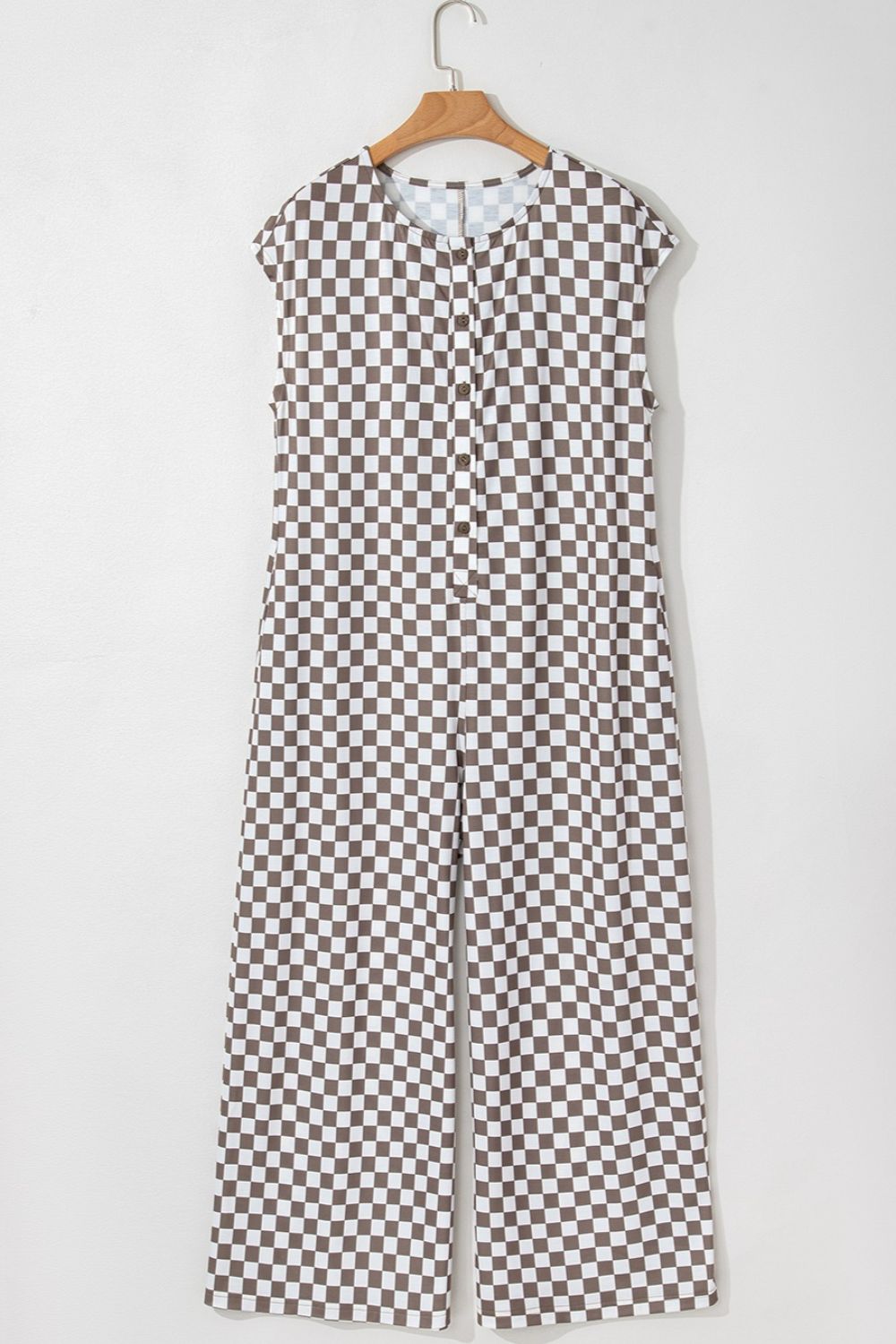 Checkered palazzo jumpsuit in mocha with cap sleeves and button front.