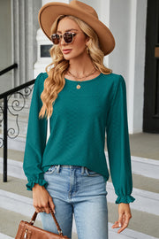 Teal textured puff sleeve blouse with ruffled cuffs and crew neck.