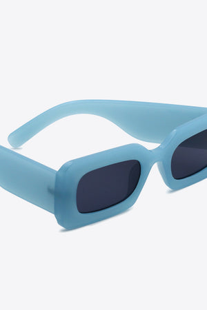 Teal acetate rectangle sunglasses with dark lenses and a matte finish.