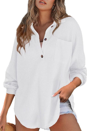 White waffle knit henley shirt with button placket and chest pocket.