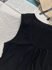 Black polyester tank top with scoop neck and gathered detail at bust.