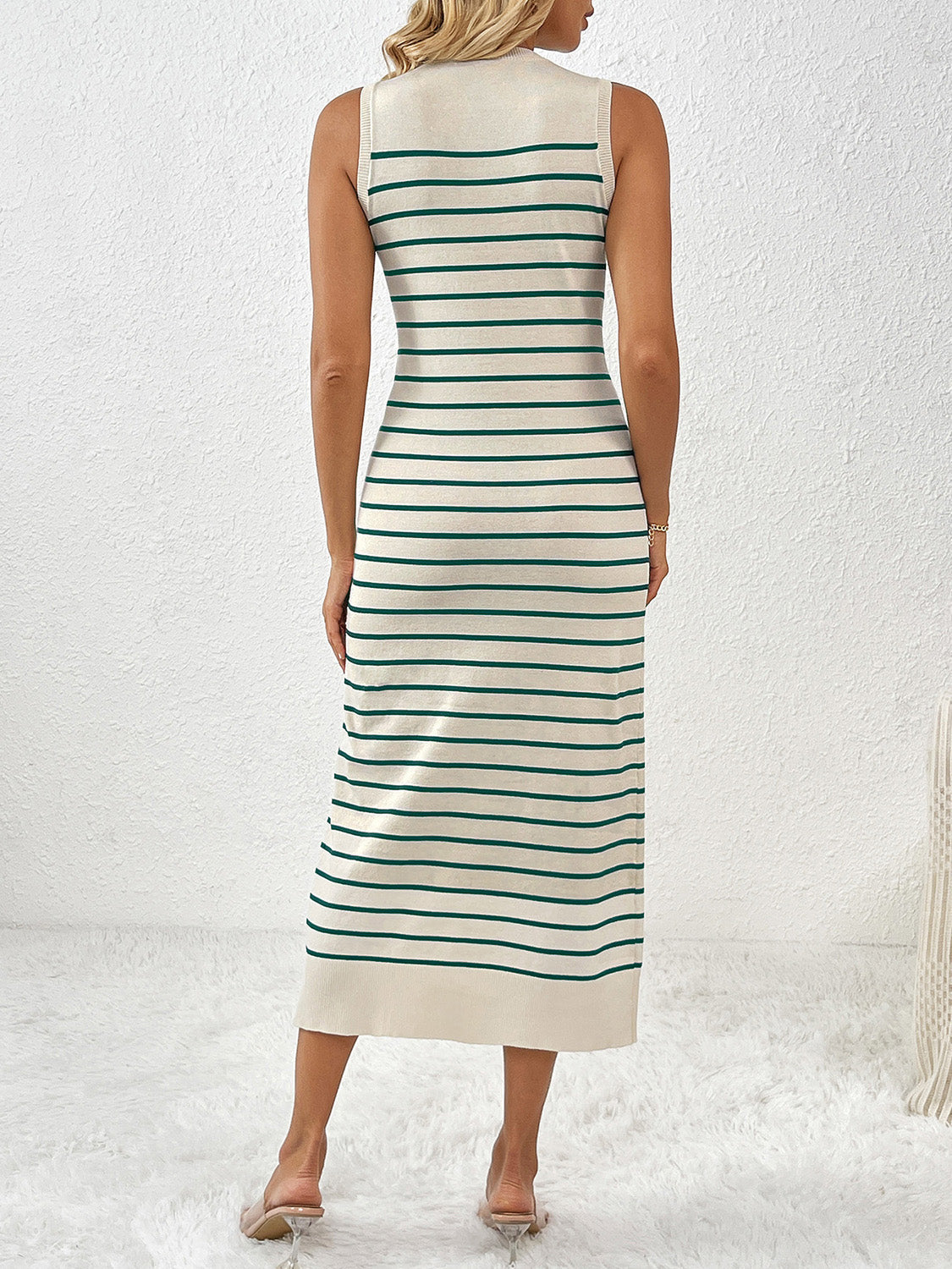 Striped ribbed sleeveless midi dress in cream with green stripes.
