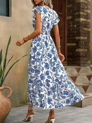 Botanical print midi dress in Cerulean with ruffle sleeves and tiered skirt.