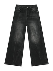 Dark wash denim wide leg jeans with a distressed, faded look and a comfortable fit.