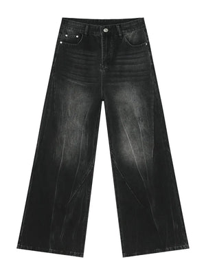 Dark wash denim wide leg jeans with a distressed, faded look and a comfortable fit.