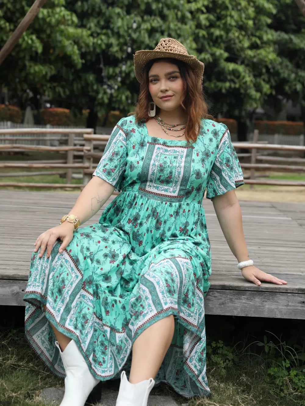 Green floral maxi dress with square neck and short sleeves, boho print.
