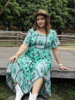 Green floral maxi dress with square neck and short sleeves, boho print.