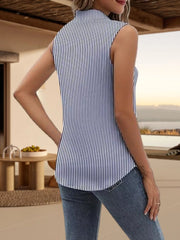 Sleeveless button-up blouse with navy and white vertical stripes.