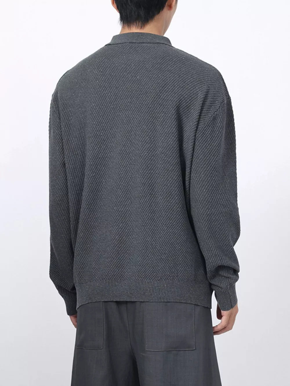Men's dark gray textured knit polo with long sleeves and a classic collar.