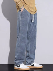 Air Force Blue relaxed fit jeans with drawstring waist and visible stitching detail.