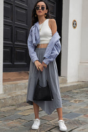 Light wash denim cropped jacket with raw hem detail and distressed sleeves.