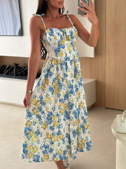 Tie-shoulder midi dress with blue floral and lemon print, sweetheart neckline, and adjustable straps.