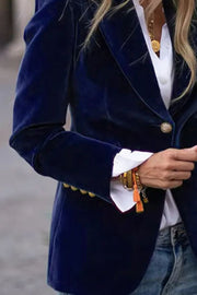 Navy velvet bolero jacket with gold buttons and ornate cuff detail.
