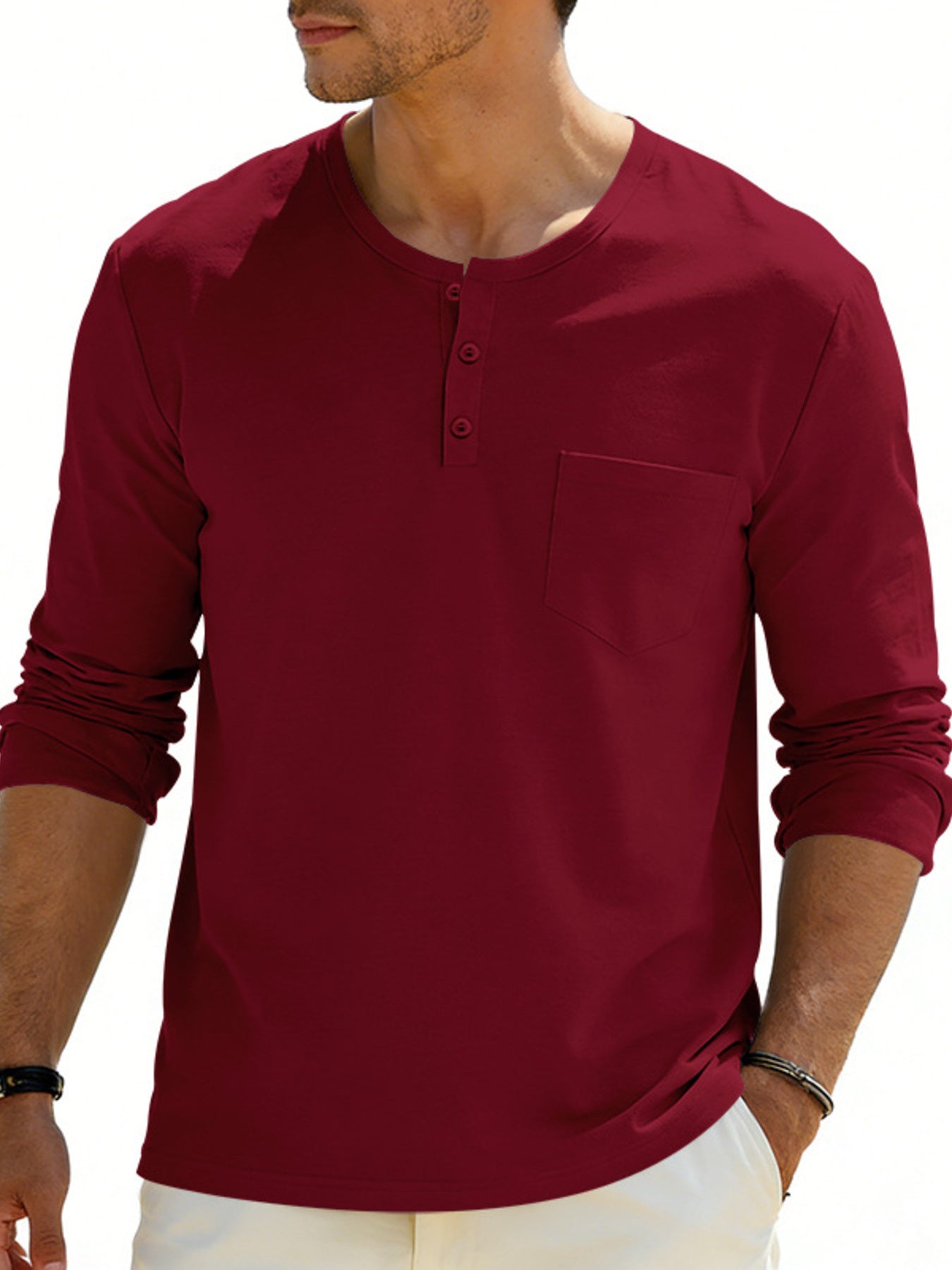 Burgundy long sleeve pocketed henley t-shirt with button placket.