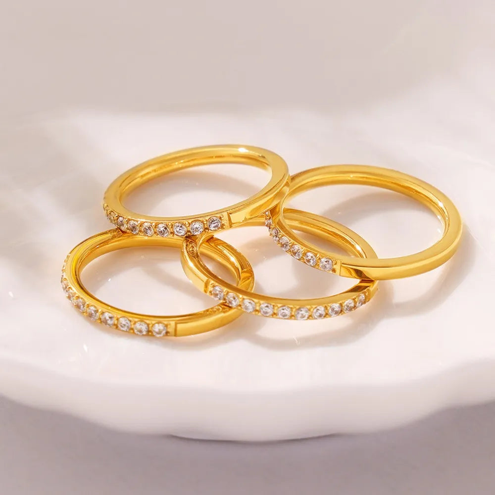 Gold pavé band stacking rings with clear stones, 18K gold-plated set of four