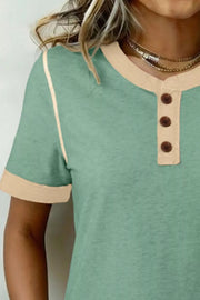 Green cotton henley blouse with beige trim and buttons