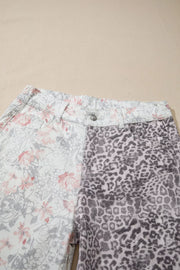 Floral and leopard print wide-leg jeans with a high waist and button closure.