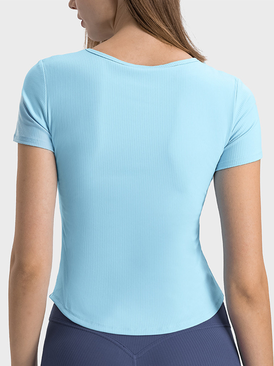 Pastel blue ribbed active top with short sleeves and a notch neck.
