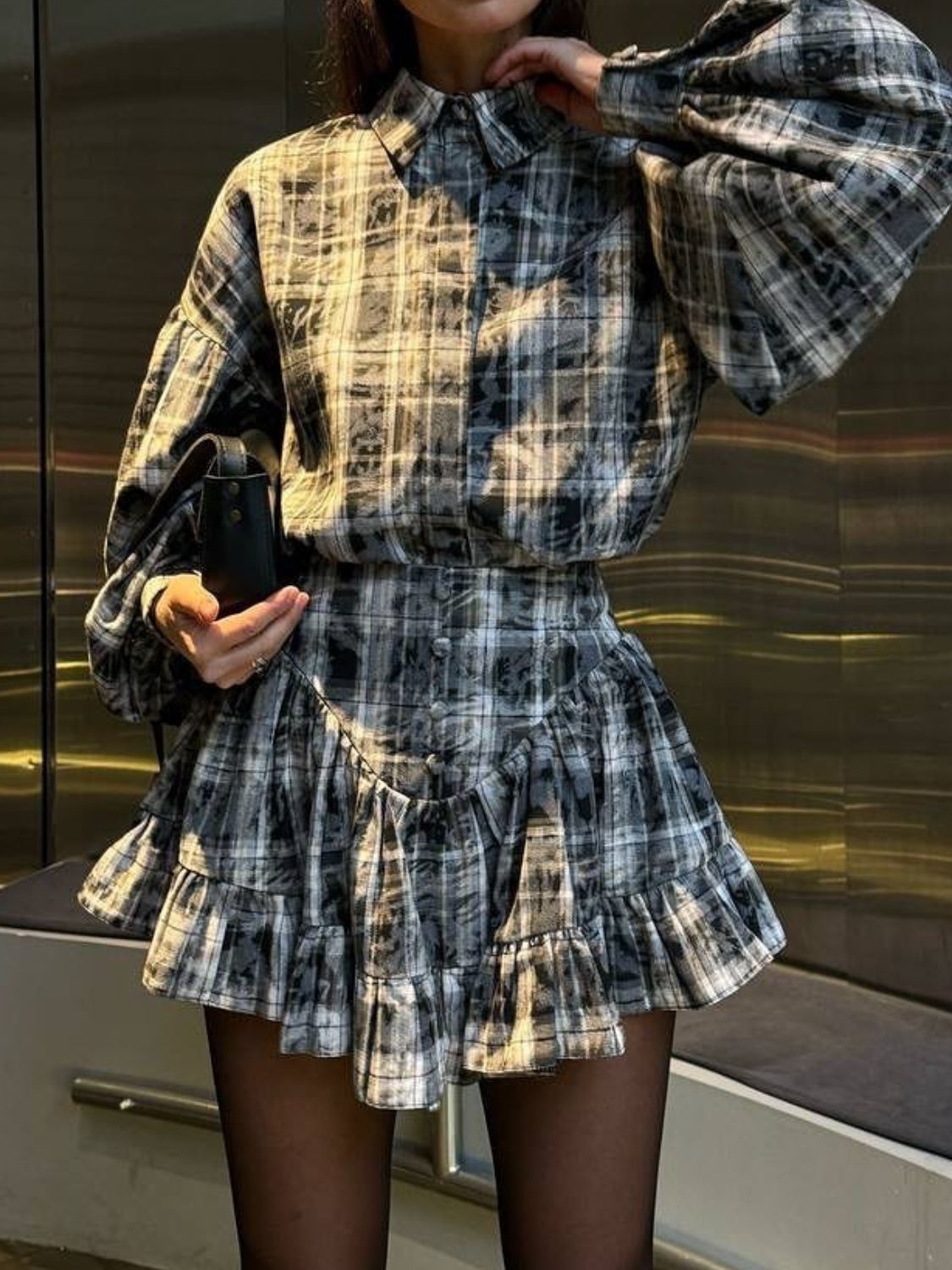 Plaid puff sleeve set in dark gray with ruffled hem skirt and button detail.