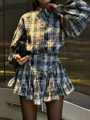 Plaid puff sleeve set in dark gray with ruffled hem skirt and button detail.