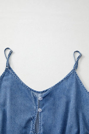Medium wash denim romper with spaghetti straps and button detail